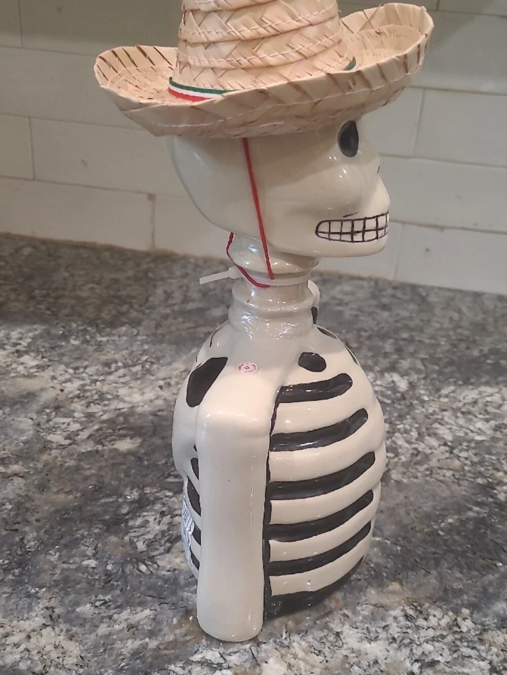 Ceramic Skeleton Bust Décor in White and Black with Straw Hat Accent